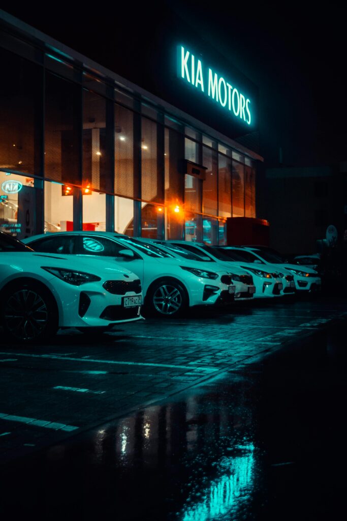pexels-photo-1685111-1685111 White Vehicles Parked outside Kia Motors Building