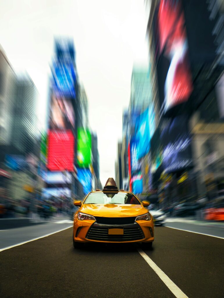 pexels-photo-2570216-2570216 Selective Photo of Yellow Cab on Road