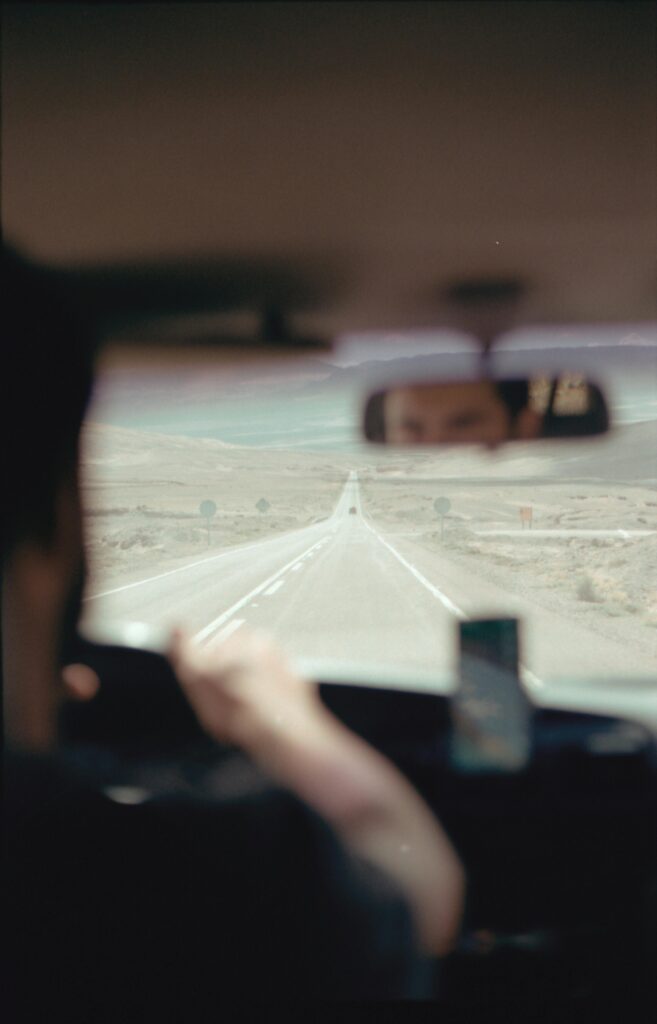 pexels-photo-4797632-4797632 A Man Driving a Car on the Long Road