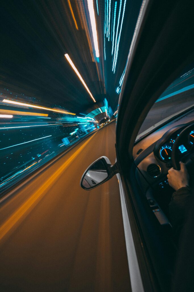 pexels-photo-5092827-5092827 Close-up Shot of Fast Moving Car on the Road